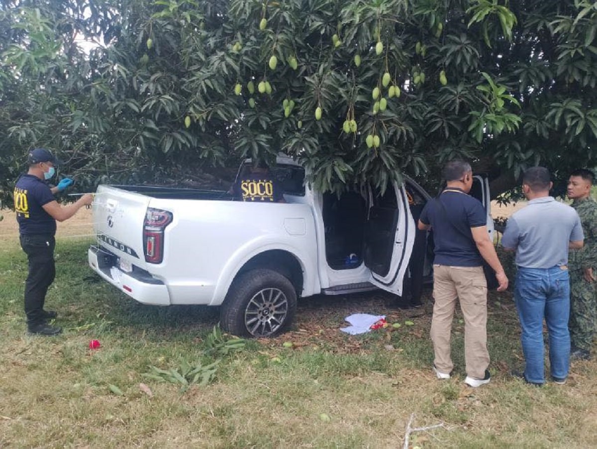 INVESTIGATION. Scene of the Crime Operatives carefully collect evidence from the pickup truck that was allegedly used by the gunmen who attacked a candidate for councilor and two others in San Pablo, Isabela on Friday, April 25.